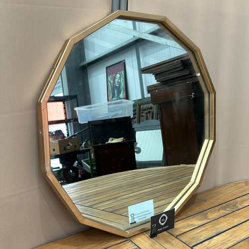 110 - Octagonal wall mirror with a metal frame, featuring a contemporary design.