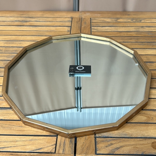 110 - Octagonal wall mirror with a metal frame, featuring a contemporary design.