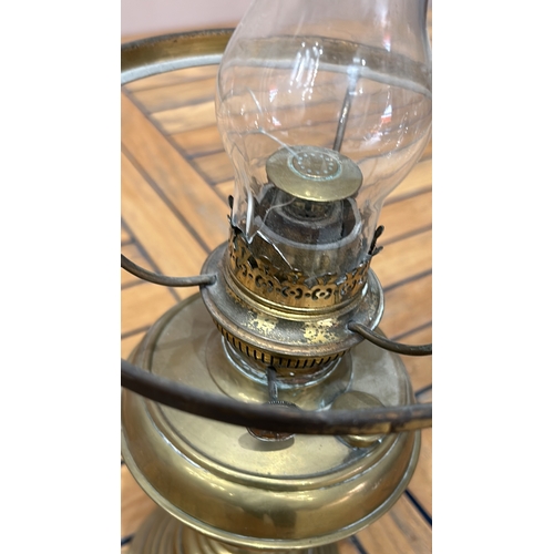 348 - Antique brass oil lamp with etched glass shade, featuring intricate floral patterns. From the late 1... 