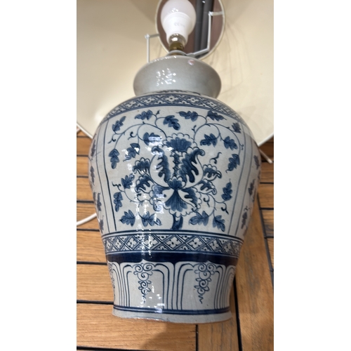 349 - Large Blue and white Chinese Ming Style ceramic lamp with floral motifs and a beige shade. It featur... 