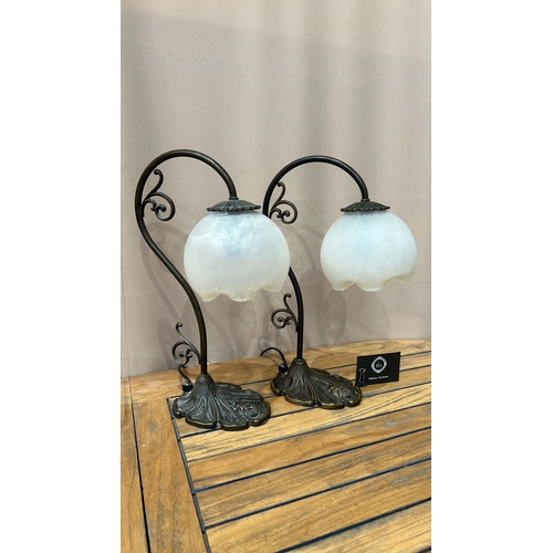 351 - Pair of Art Nouveau-style table lamps with frosted glass shades and ornate bronze bases featuring fl... 