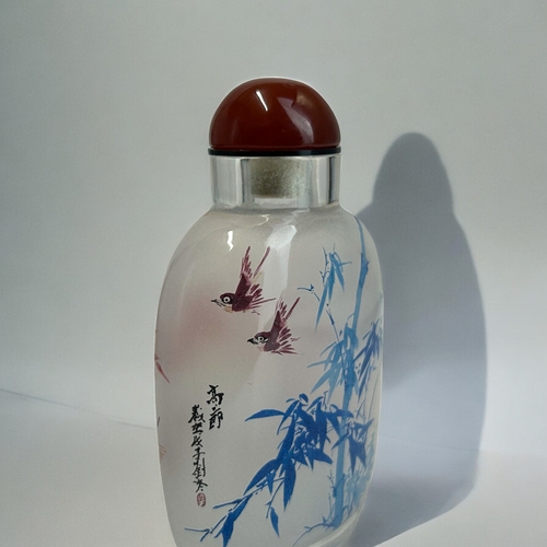 30 - A Chinese Inside Painted glass snuff bottle.Painted Bamboo in blue with flying birds. Red bamboo sce... 