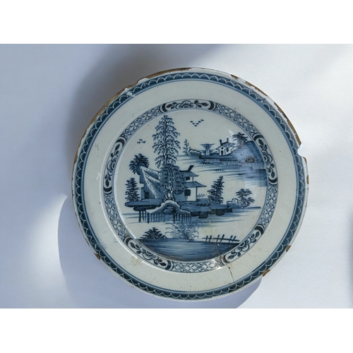 301 - A mid-18th century Lambeth Delft Charger.Painted 'Chinoiserie' landscape. Diameter - 35cm... 