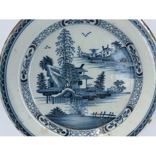 301 - A mid-18th century Lambeth Delft Charger.Painted 'Chinoiserie' landscape. Diameter - 35cm... 