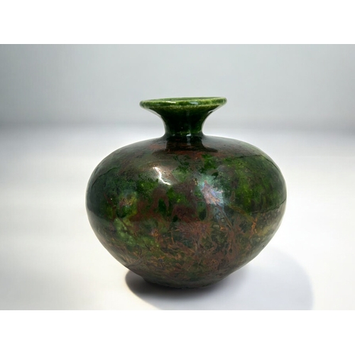 314 - A Russell Akerman Raku glaze pottery vase.Squat form, with green & copper glaze. Signed to base.... 