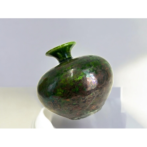 314 - A Russell Akerman Raku glaze pottery vase.Squat form, with green & copper glaze. Signed to base.... 