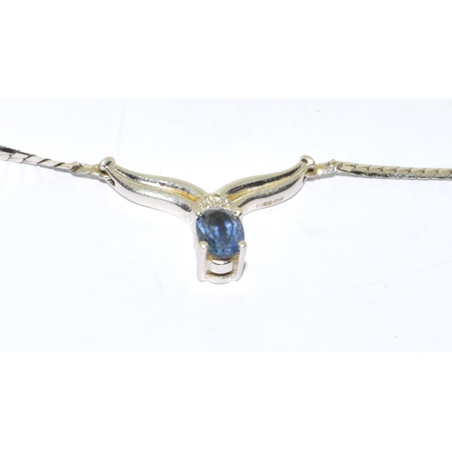 128 - 9ct white gold Sapphire and Diamond wish bone pendant necklace with a 40cm long chain