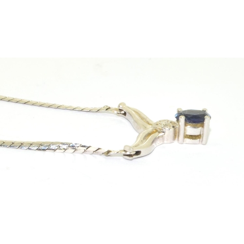 128 - 9ct white gold Sapphire and Diamond wish bone pendant necklace with a 40cm long chain