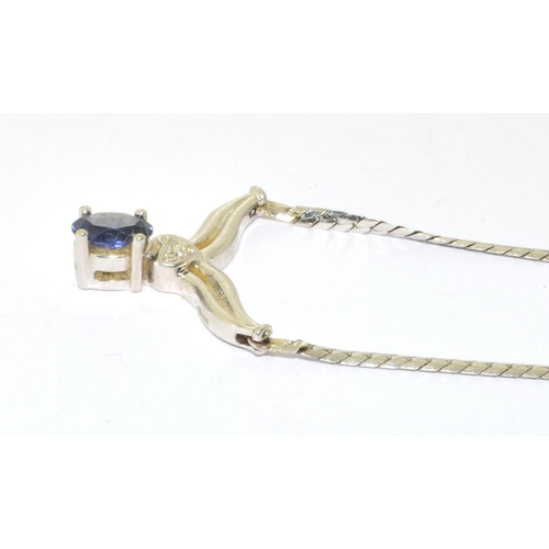 128 - 9ct white gold Sapphire and Diamond wish bone pendant necklace with a 40cm long chain