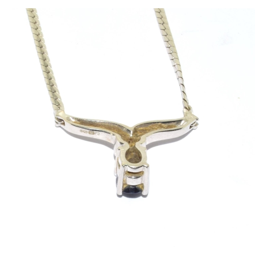 128 - 9ct white gold Sapphire and Diamond wish bone pendant necklace with a 40cm long chain