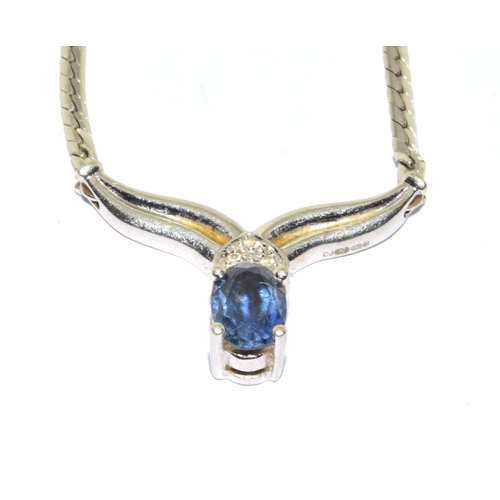 128 - 9ct white gold Sapphire and Diamond wish bone pendant necklace with a 40cm long chain