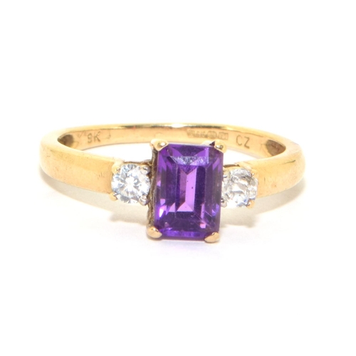 141 - 9ct gold ladies good emerald cut Amethyst solitaire with clear stone decoration size P