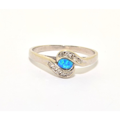 38 - 9ct white gold ladies Opal and Diamond twist ring size Q