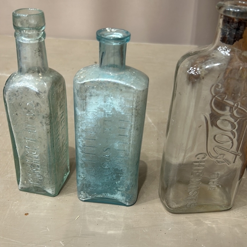 331 - Collection of vintage glass bottles, including various shapes and colors , Together with a small vin... 