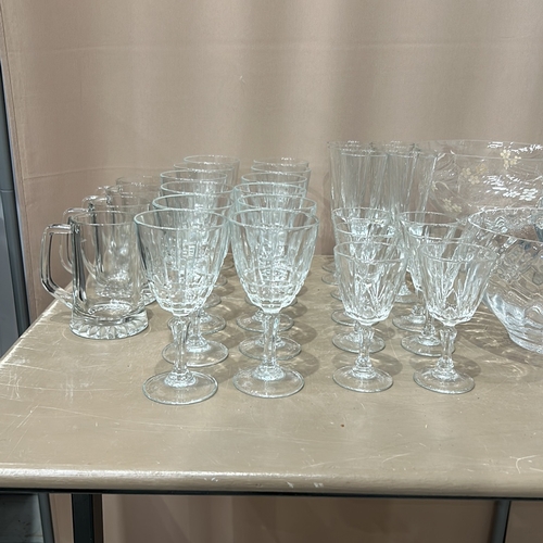 332 - Large quantity of assorted glassware, featuring intricate etched designs. Comprises various sizes an... 