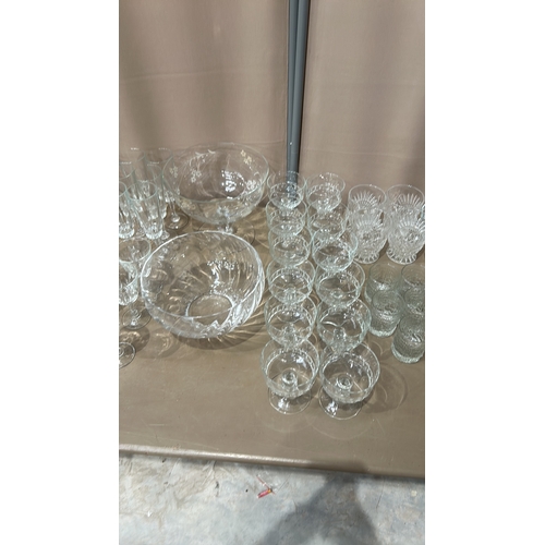 332 - Large quantity of assorted glassware, featuring intricate etched designs. Comprises various sizes an... 