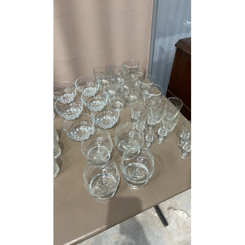 332 - Large quantity of assorted glassware, featuring intricate etched designs. Comprises various sizes an... 