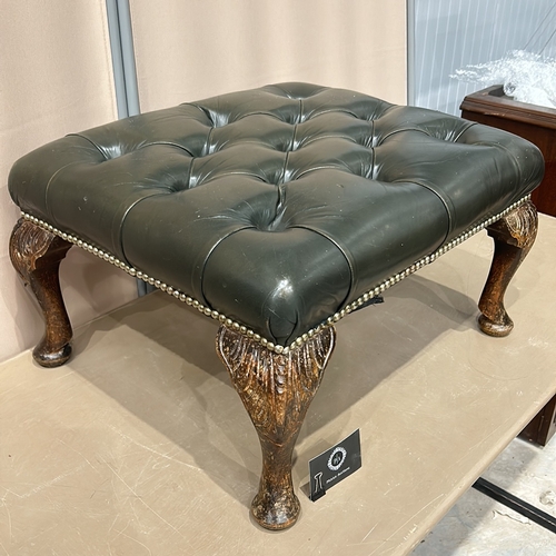 120 - Dark green leather deep-buttoned top stool set on carved cabriole legs.