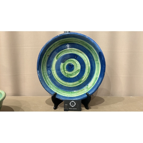 213 - 2 Large Studio Pottery bowls in blue and green glaze feature a spiral design inside.