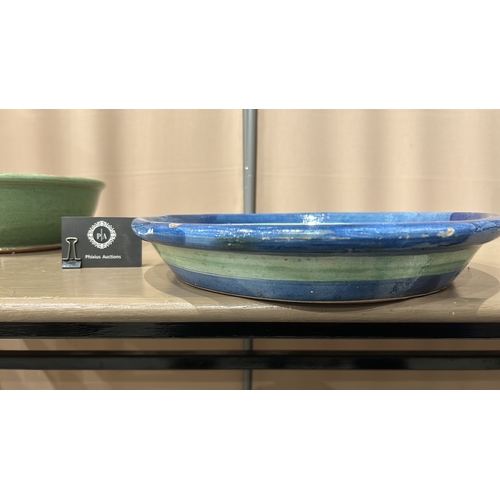 213 - 2 Large Studio Pottery bowls in blue and green glaze feature a spiral design inside.