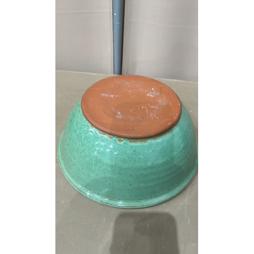 213 - 2 Large Studio Pottery bowls in blue and green glaze feature a spiral design inside.