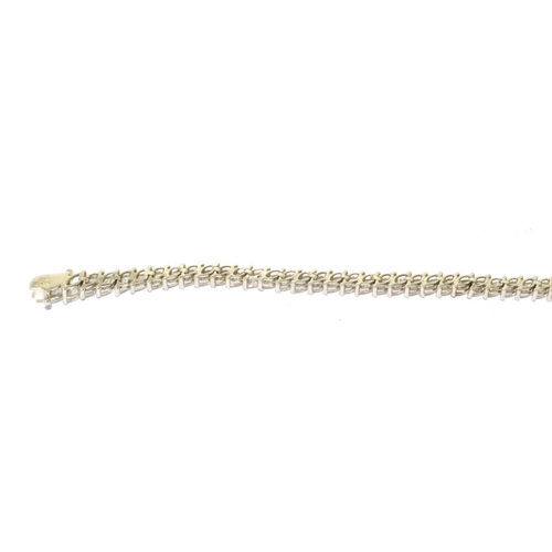 283 - 9ct white gold fancy tennis line bracelet 11g 18cm long 