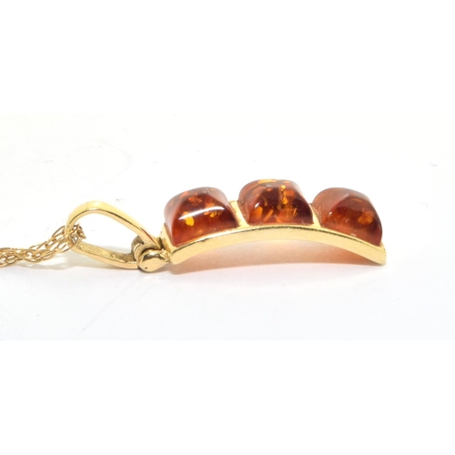 78 - 9ct gold Amber three drop pendant necklace set on a 46cm long chain 