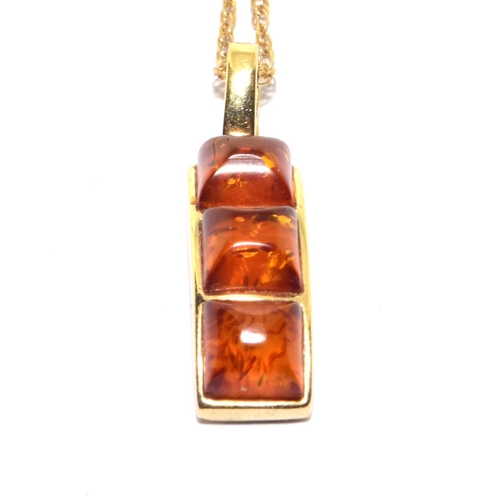 78 - 9ct gold Amber three drop pendant necklace set on a 46cm long chain 