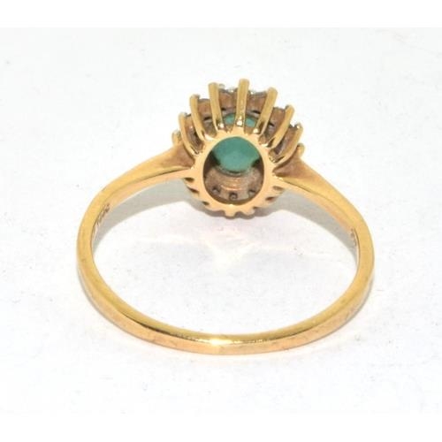 118 - 9ct gold ladies Emerald halo cluster ring size O