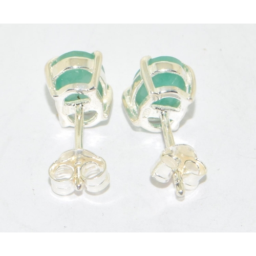 284 - Pair emerald stud earrings on silver posts