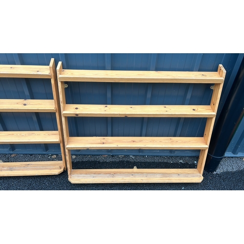 123 - Pair of wooden wall-mounted shelves, featuring three tiers each, crafted from light stained pine.