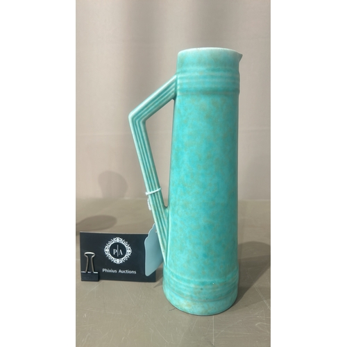 216 - Vintage Turquoise ceramic pitchers, featuring an Art Deco style with sleek geometric handles. From t... 