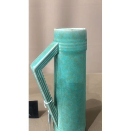 216 - Vintage Turquoise ceramic pitchers, featuring an Art Deco style with sleek geometric handles. From t... 