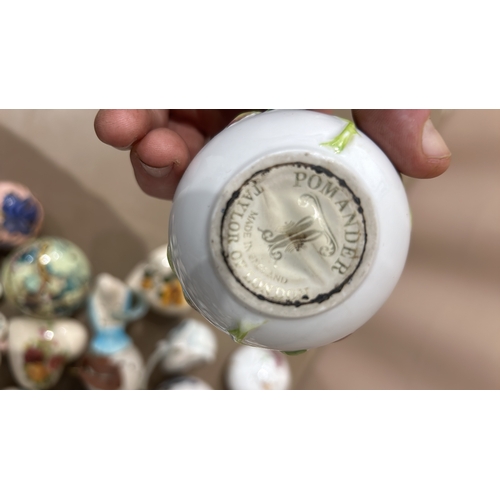 217 - A Large Porcelain pomander collection features various floral and figural designs with Taylor of Lon... 