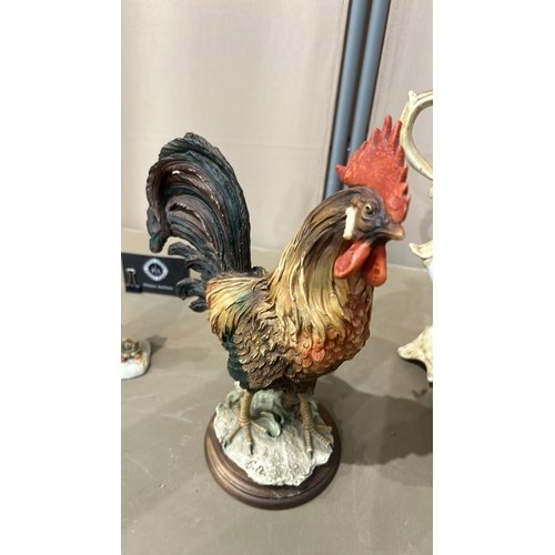 219 - A Large rooster figurine, detailed with vibrant colors, marked with a G.A. together with a Capodimon... 