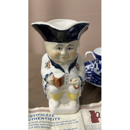 221 - Royal Worcester tea set with floral blue pattern and Ralph Wood Toby jug. Includes certificate of au... 