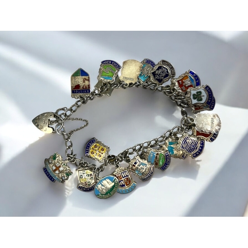 542 - S Silver charm bracelet, together with 21 silver & enamel charms.