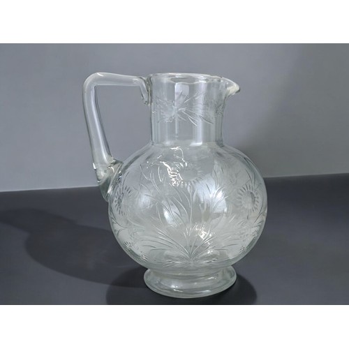 569 - Christopher Dresser for James Powell & sons jug.Circa 1875.Engraved foliate designs. This jug ca... 