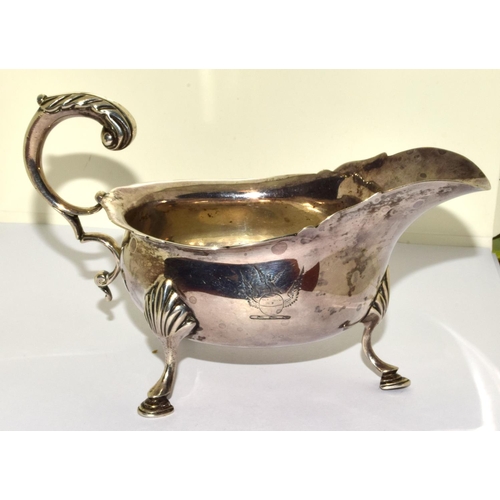 9 - Solid silver hallmarked 3 leg sauce boat set on hoof feet with a scroll handle 170grm