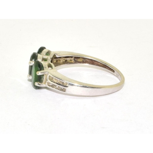 246 - 9ct white gold Emerald and accent Diamond triple stone ring size N