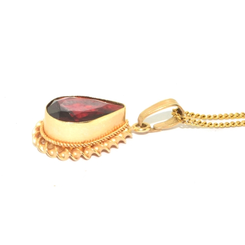 251 - 9ct gold Garnet pear shape pendant necklace in an enclosed setting on a 44cm long chain 