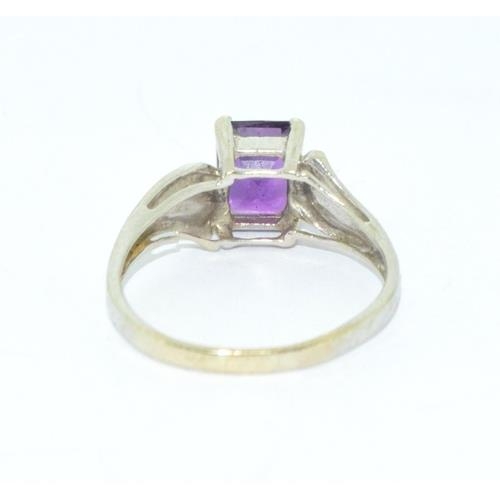 273 - 9ct white gold ladies Amethyst oblong cut solitaire ring size N