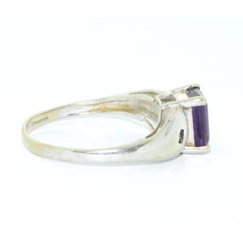 273 - 9ct white gold ladies Amethyst oblong cut solitaire ring size N