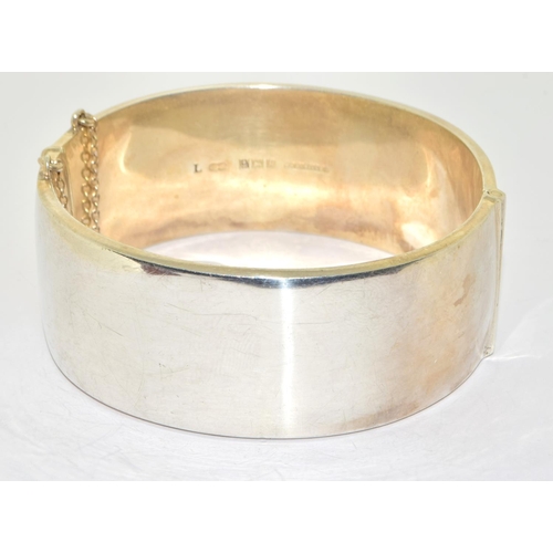 322 - Large 925 silver Embossed solid bangle with safety chain 7cm diameter 2.5cm wide 65grm