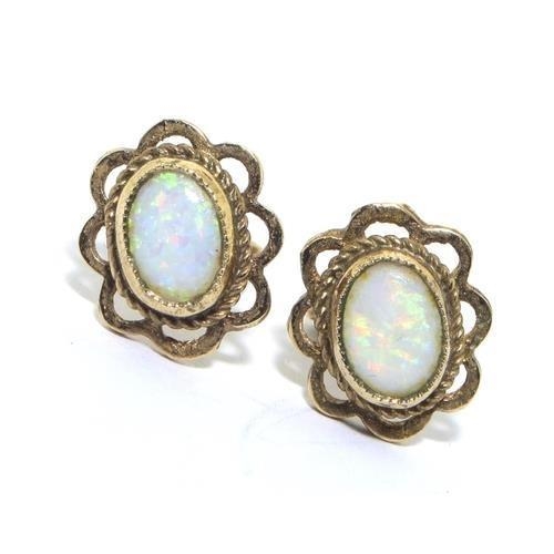 306 - 9ct gold Opal open work set ear studs with scroll fixings