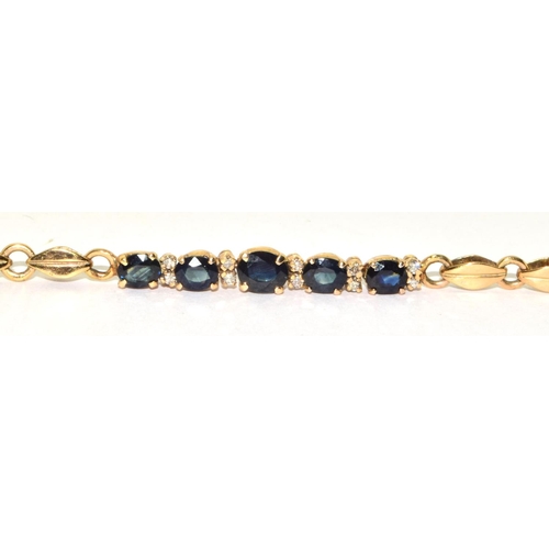 373 - 9ct gold ladies Diamond and Sapphire fancy bracelet 18cm long 7.7grm 