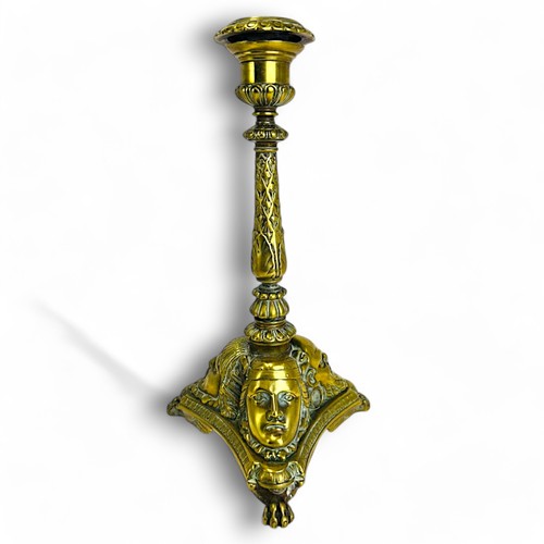 329 - A Grand Tour gilt bronze candlestick.France, 19th century.Sat on three winged Lion paw feet, with st... 