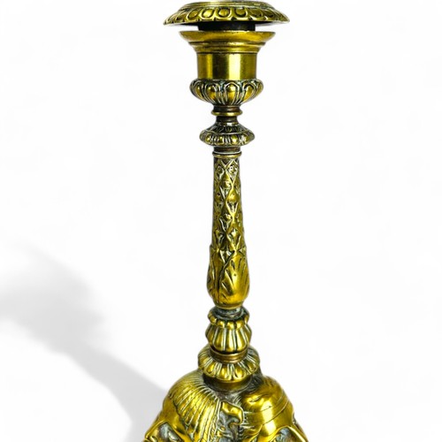 329 - A Grand Tour gilt bronze candlestick.France, 19th century.Sat on three winged Lion paw feet, with st... 