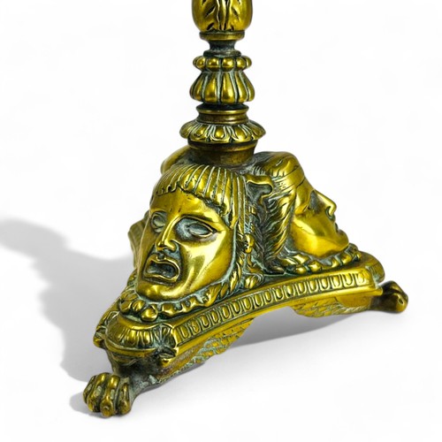 329 - A Grand Tour gilt bronze candlestick.France, 19th century.Sat on three winged Lion paw feet, with st... 