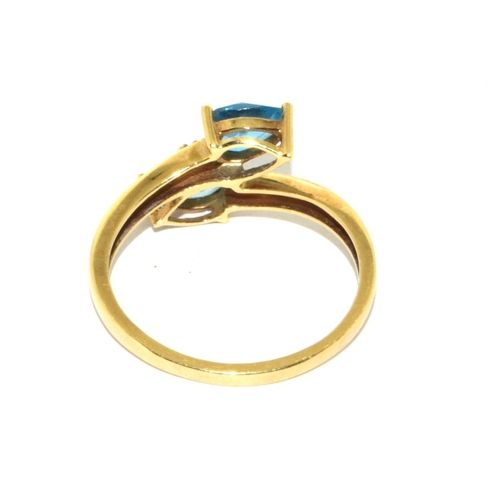 336 - 9ct gold ladies Aquamarine and accent Diamond shoulder twist design ring size T